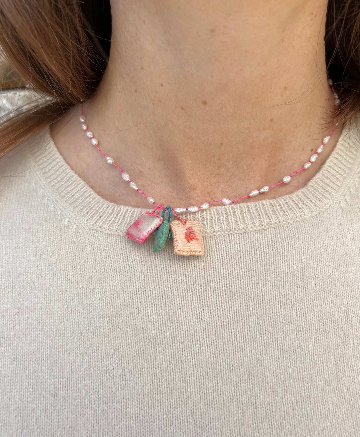 Necklace - ‘Sophia’ Mother Pearl necklace with tie and dye pink, turquoise and salmon cushions